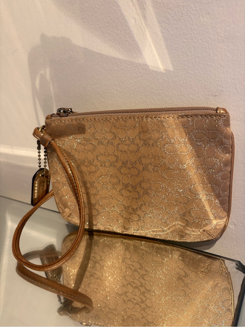 Gold sparkly coach wristlet